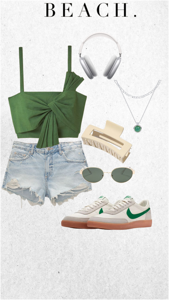  Casual beach look with denim shorts, green crop top, and vintage sneakers styled for a sporty summer day near the coast.